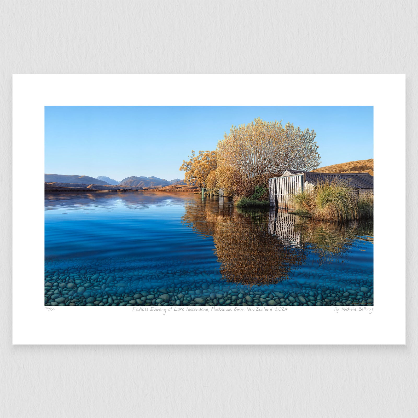 An artwork depicting a serene lake scene with a boat shed, tree, and clear blue water reflecting the sky at Lake Alexandrina.