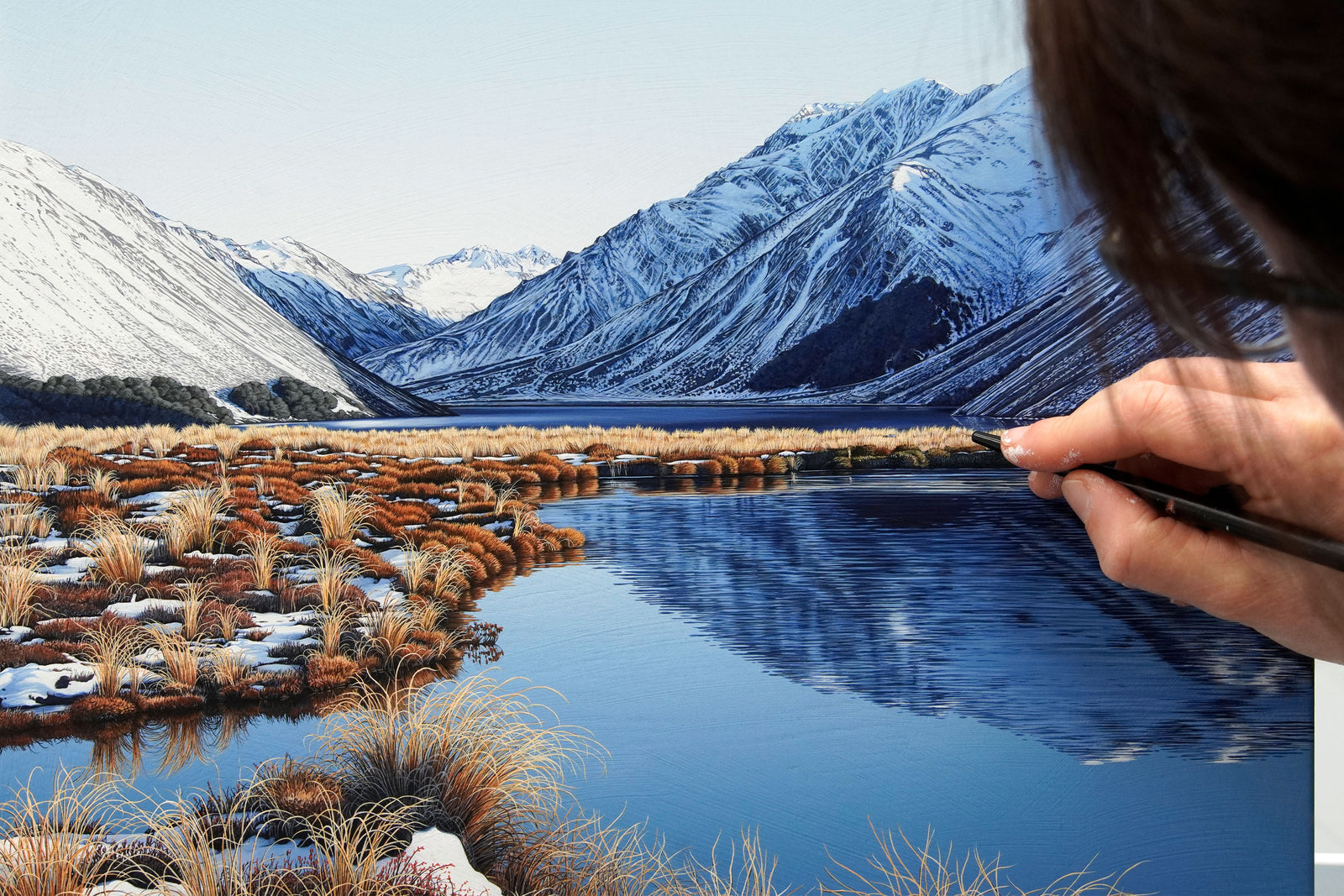 Lake Tennyson in the St James Conservation Area with the impressive Crystal Peak, part of the Crimea Range at 2020m in the background. A snowy glimpse of the St James Range can be seen in the background near the Clarence Pass.