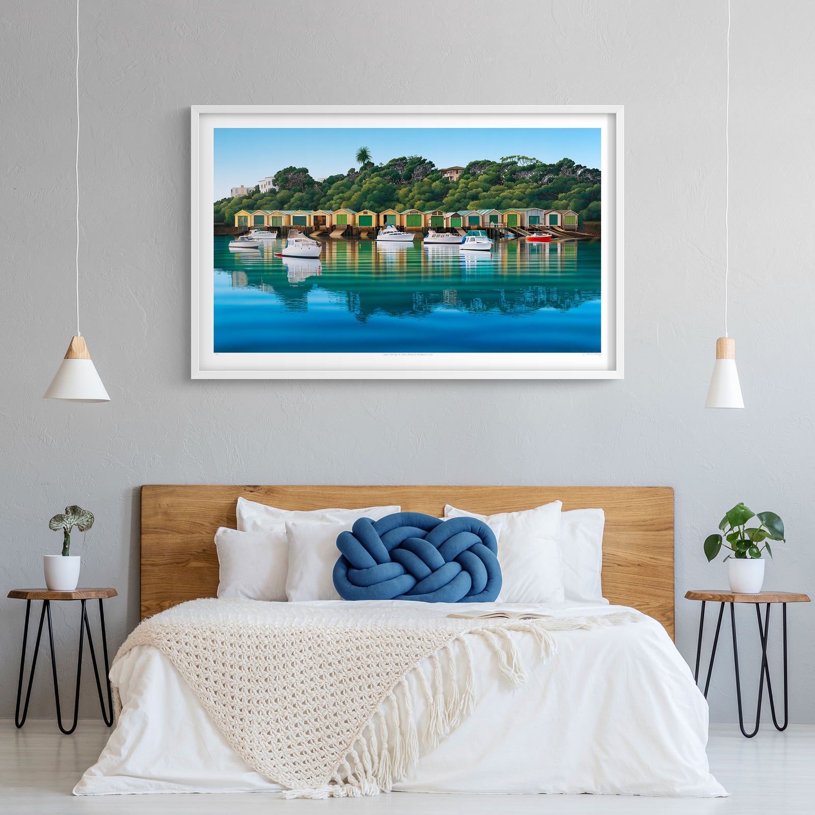 A unframed art print featuring seven moored boats on the calm waters of the Orakei Basin, with vibrant orange contrasting with the predominantly blue and green hues.